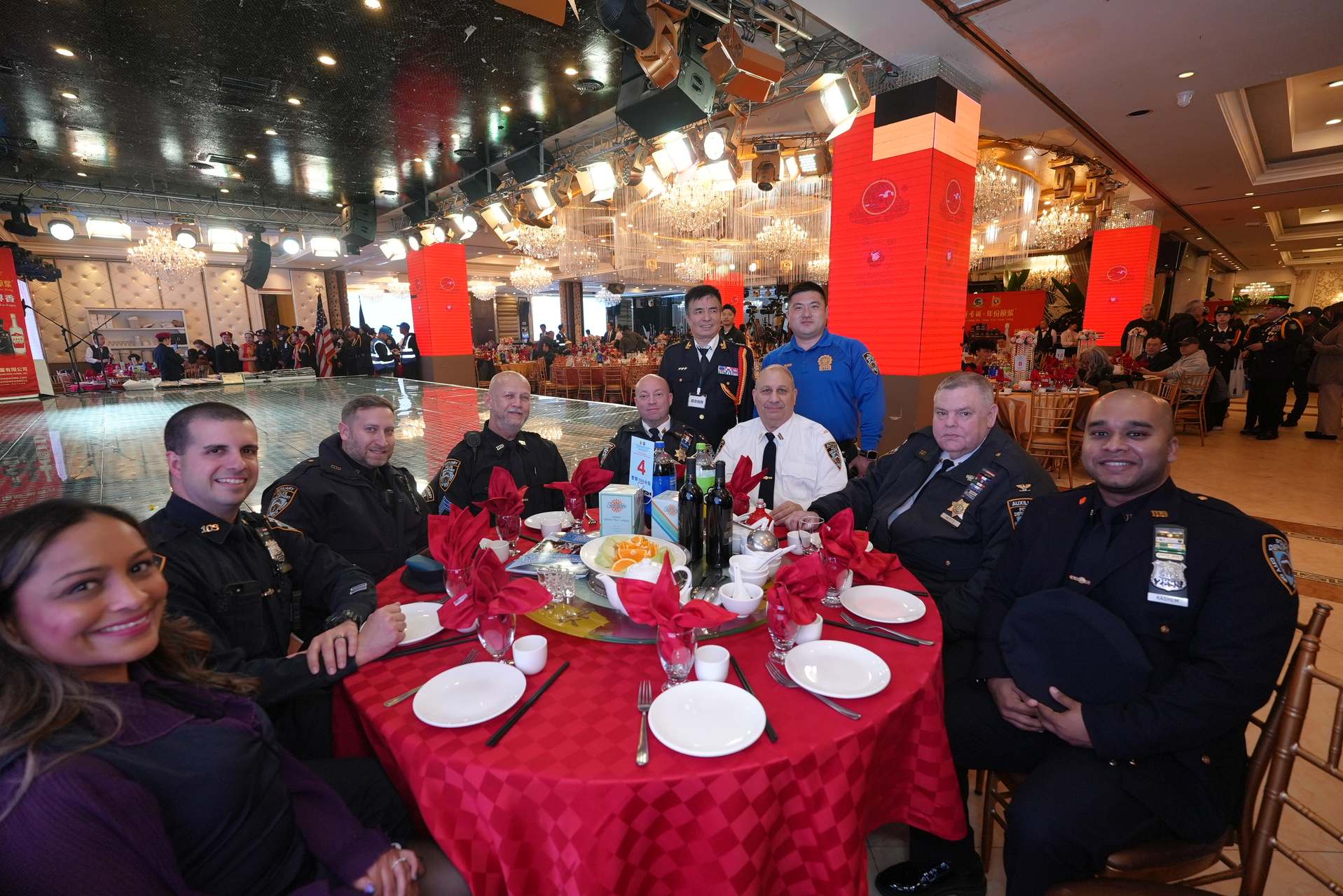 NYPD officers and foundation members at a community fellowship dinner — building bonds between law enforcement and the public