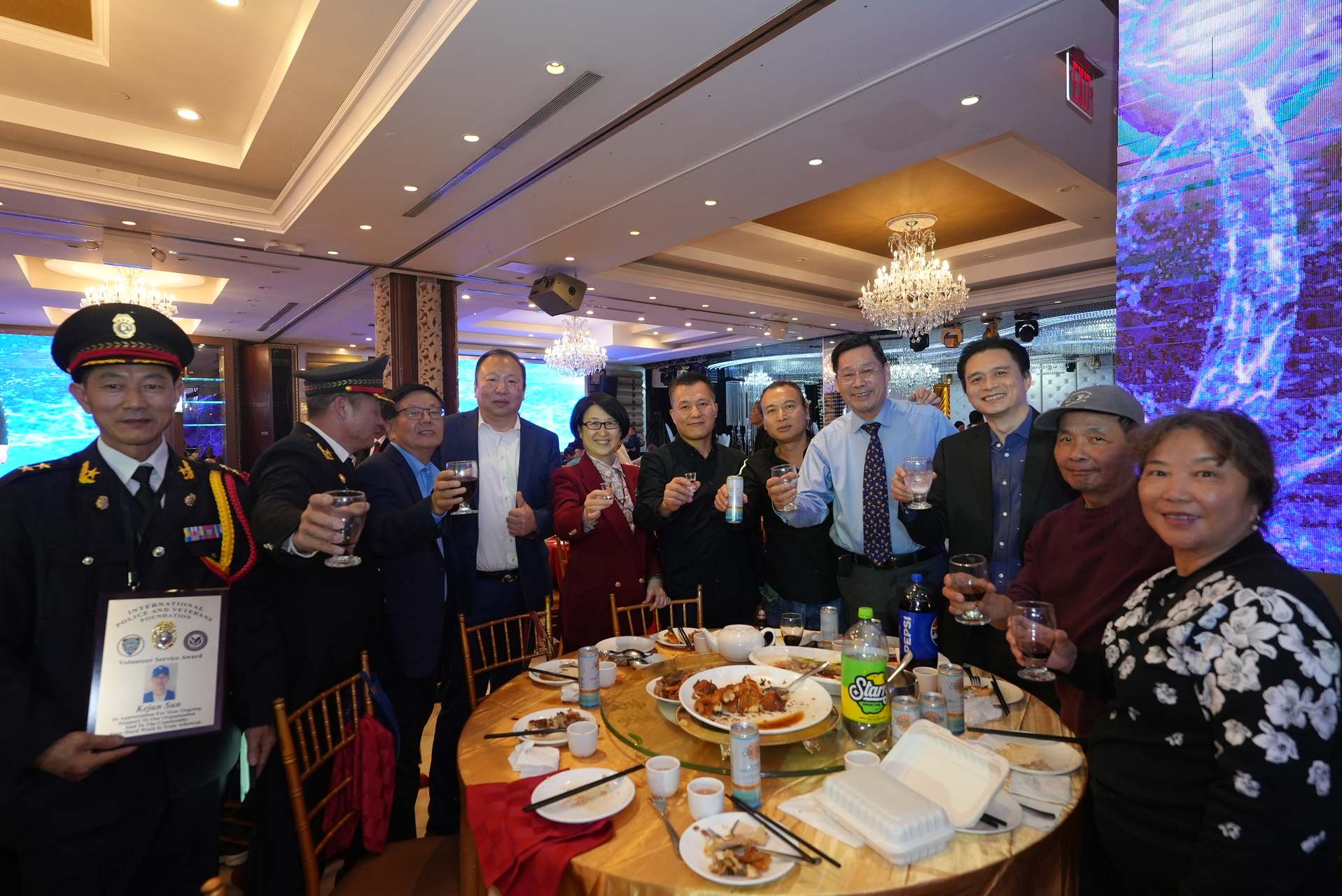 Foundation members and NYPD officers celebrating at a community recognition banquet in New York